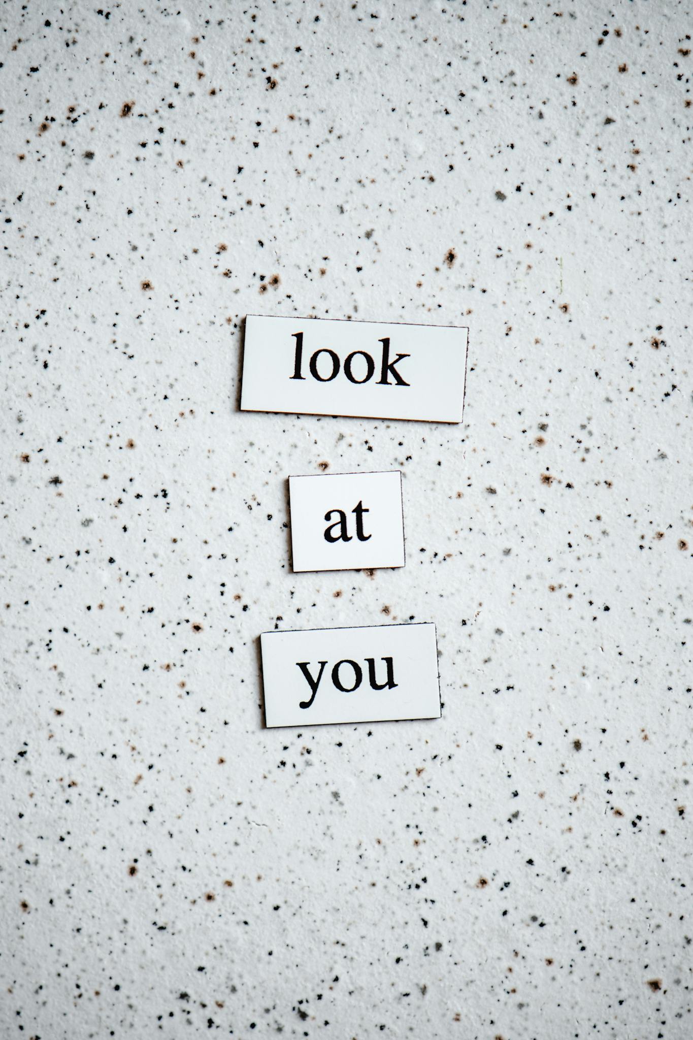 Inspirational message "look at you" on a speckled background for motivation.